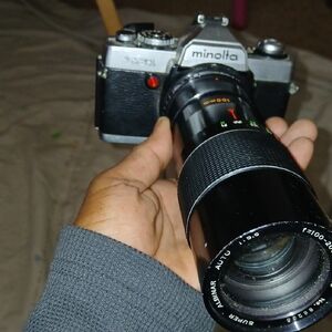 vintage Minolta SR-T series 35mm SLR film camera with a z